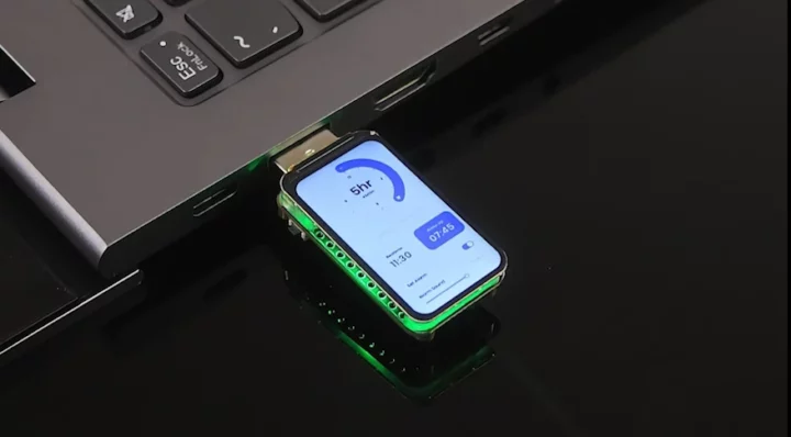 ESP32-S3 USB drive with display connected to laptop